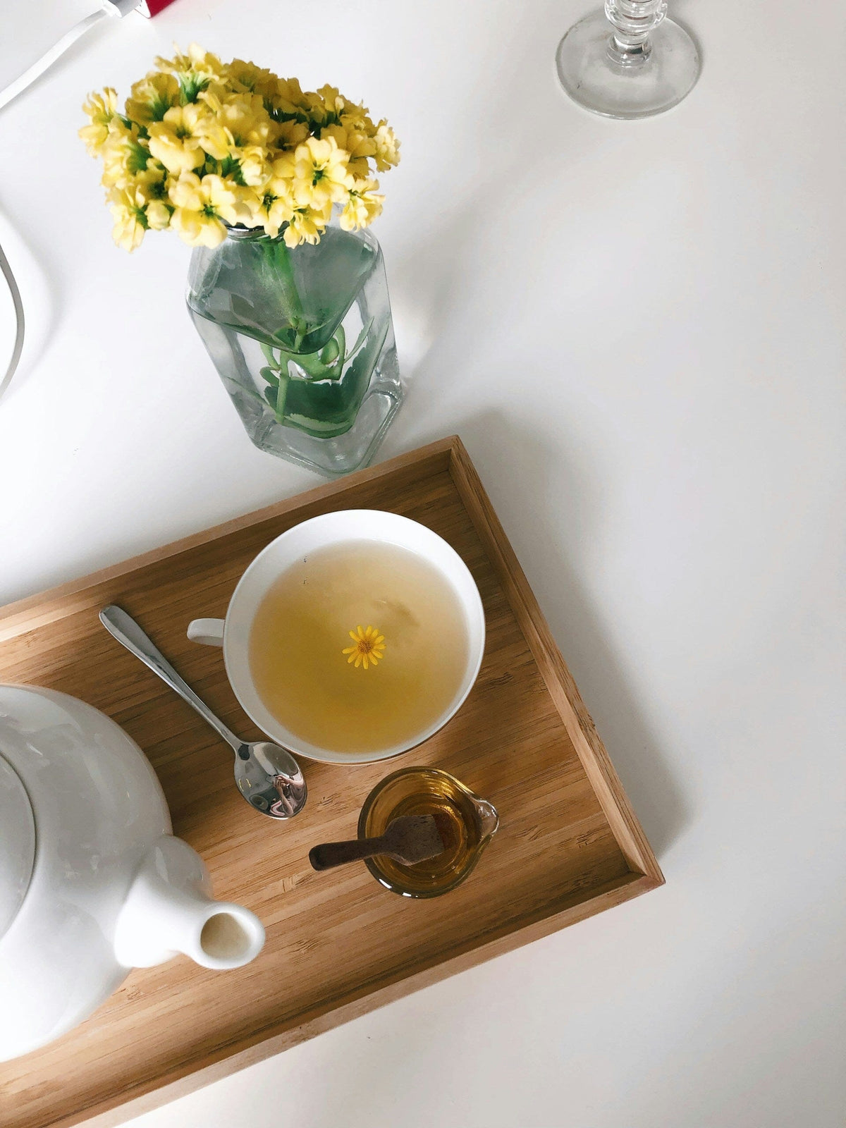 Herbal tea on a tray with flowers