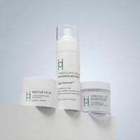 The Best Sellers Trio is displayed on a white surface against a light blue background, showcasing the elegant design and nourishing benefits of these skincare essentials.