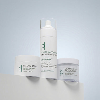 The Best Sellers Trio is displayed on a white surface against a light blue background, showcasing the elegant design and nourishing benefits of these skincare essentials.