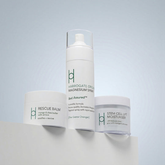 The Best Sellers Trio is displayed on a white surface against a light blue background, showcasing the elegant design and nourishing benefits of these skincare essentials.
