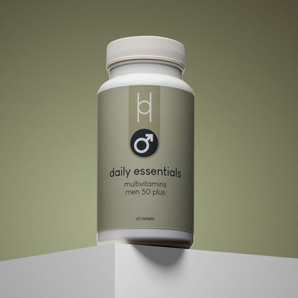 A bottle of Daily Essentials: Multivitamins for Men 50+ stands on a light surface against a gradient olive background. The minimalist label features a male gender symbol and clear text, highlighting immune-supporting vitamins and minerals.