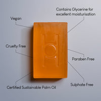 An orange rectangular bar of Fresh Mandarin - Luxe Soap with text pointing to it: vegan, cruelty free, certified sustainable palm oil, contains glycerine for moisturisation, paraben free, and sulphate free.