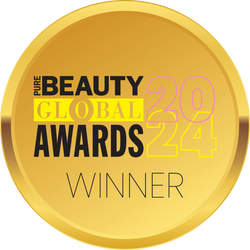 A gold circular badge with the text Pure Beauty Global Awards 2024 Winner in black, yellow, and pink letters.
