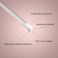 The Face & Body Exfoliator Duo | Radiant Skin Gift Set is shown: a dropper with a creamy formula and brown particles, labeled as gentle for sensitive skin, antioxidant-rich, boosts elasticity, and promotes radiant skin on a pink background.