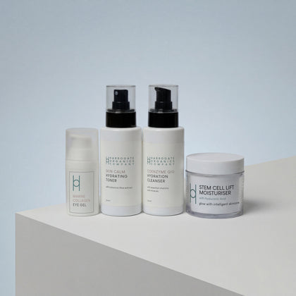 The Ultimate Men's Skincare Set | Complete 4-Piece Collection features four white skincare products—eye gel, toner, cleanser, and stem cell moisturiser—displayed on a white surface with a light grey background.