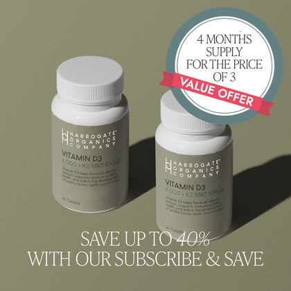 Two bottles of Multipack - Vitamin D3 & Vitamin K2 MK7 (4 Month supply) on a green surface. Badge: 4 months for the price of 3, value offer. Save up to 40% with subscribe & save and support your immune health.