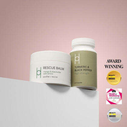 The Turmeric & Black Pepper Supplement + Rescue Balm Bundle is displayed on a white surface, both formulas designed to help reduce inflammation. Award badges are visible on the right side of the image.